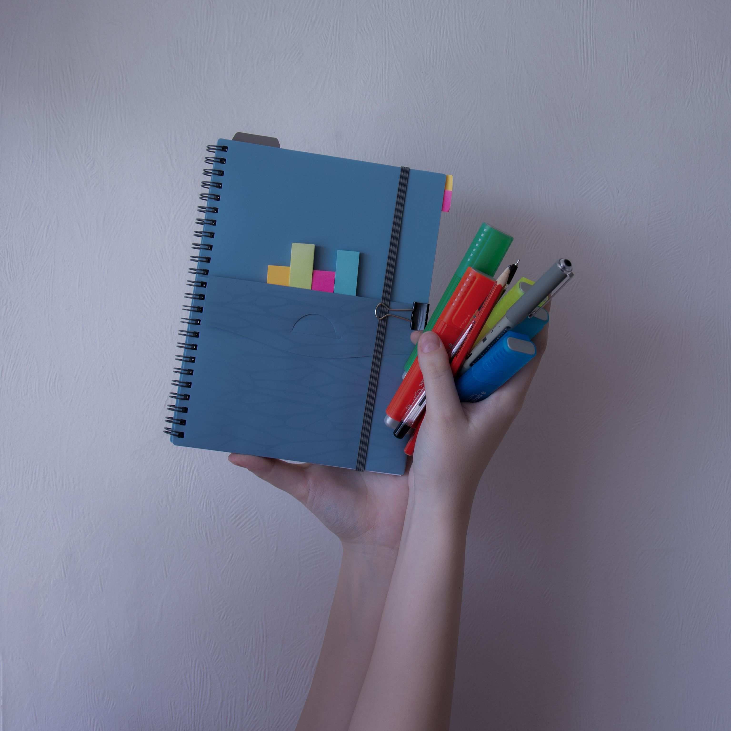 Notebook with markers and sticky notes for delivery planning