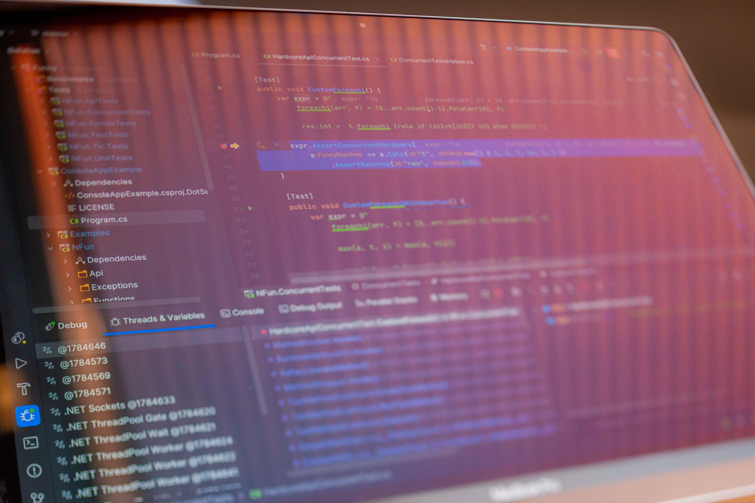 Computer screen displaying programming code with monitors